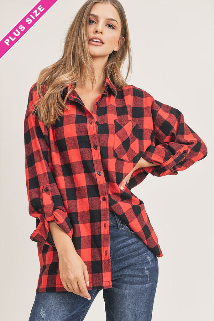 A red and black buffalo plaid over-sized flannel button down collared front pocket top.
