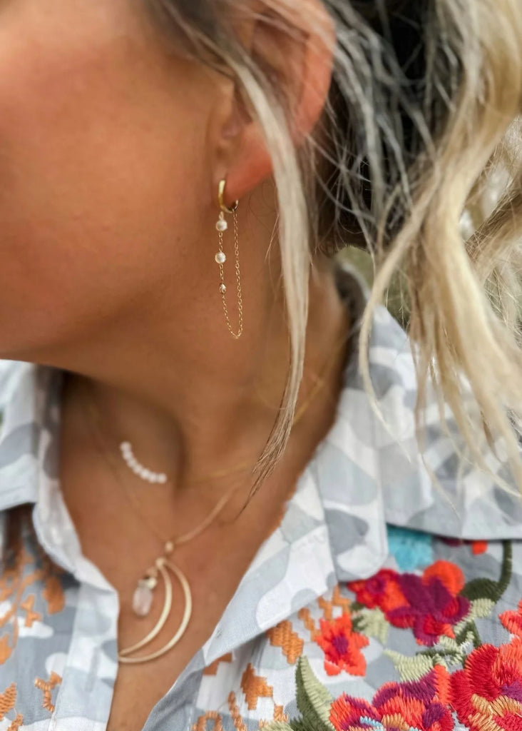 Cascade delicate chain earrings with delicate zirconia gems.