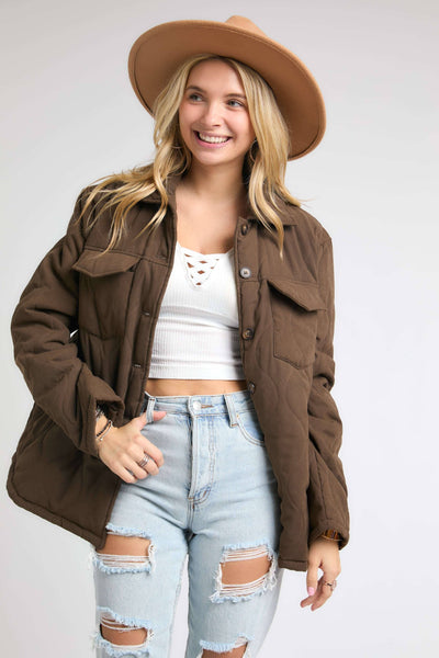 brown puffy quilted style button up jacket.  With 2 chest pockets and side hand pockets too