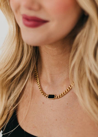 Our Black Stone Chain Necklace features a thick, gold, adjustable, chain with a black statement stone attached. 16-18 inches