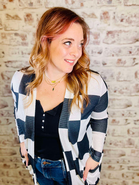 Black and white large checkers buttonless long sleeve cardigan