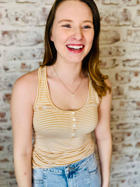 Golden yellow and white horizontal striped tank with 5 attached buttons at the chest area. light weight. model is wearing with jeans