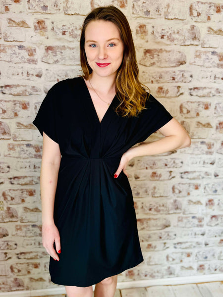 black v neck mid length short sleeve dress with short sleeves. Casual or evening wear.