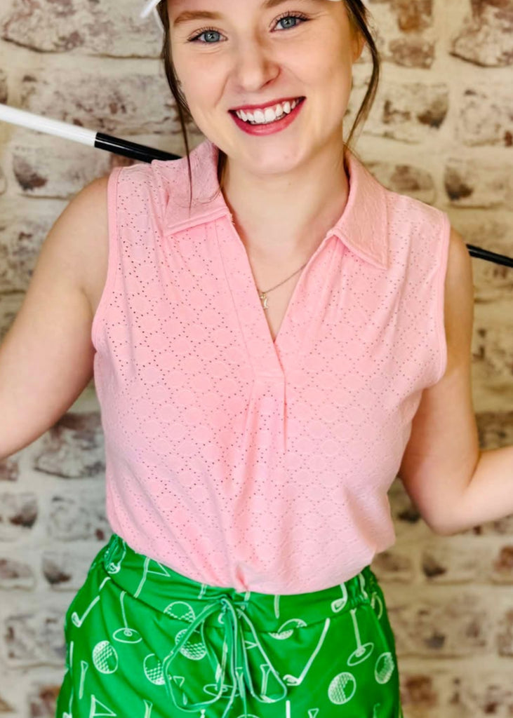 This breathable collared golf/ sport top is light weight and light pink in color