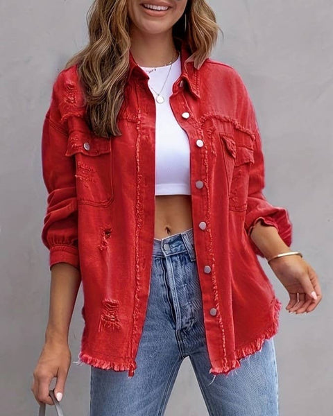 this ripped in spots frayed at the waist red denim jacket has 2 chest pockets that each have a button and the jackt has a button-down front with a collar.