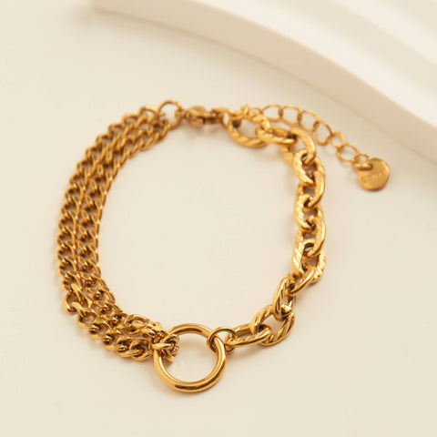 waterproof chain bracelet - gold in color 2 strands of chain on one side and 1 chain, thicker on the other side.