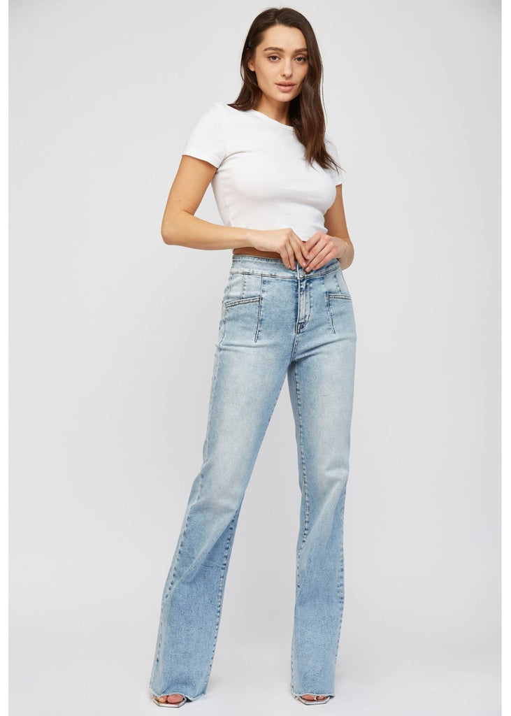 brand Mica offers a relaxed flare acid washed jean with front patch pockets.