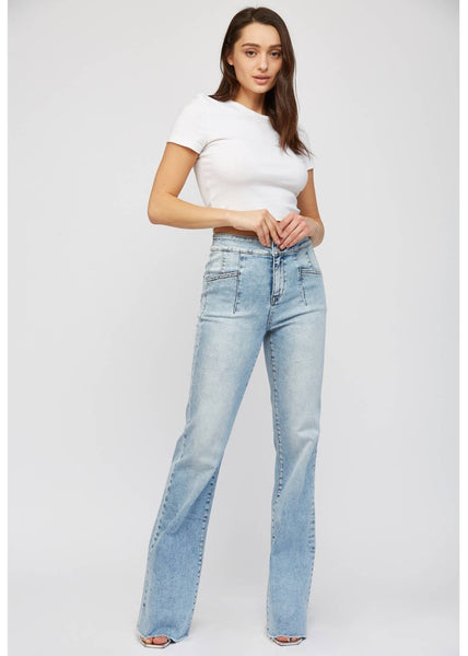 brand Mica offers a relaxed flare acid washed jean with front patch pockets.
