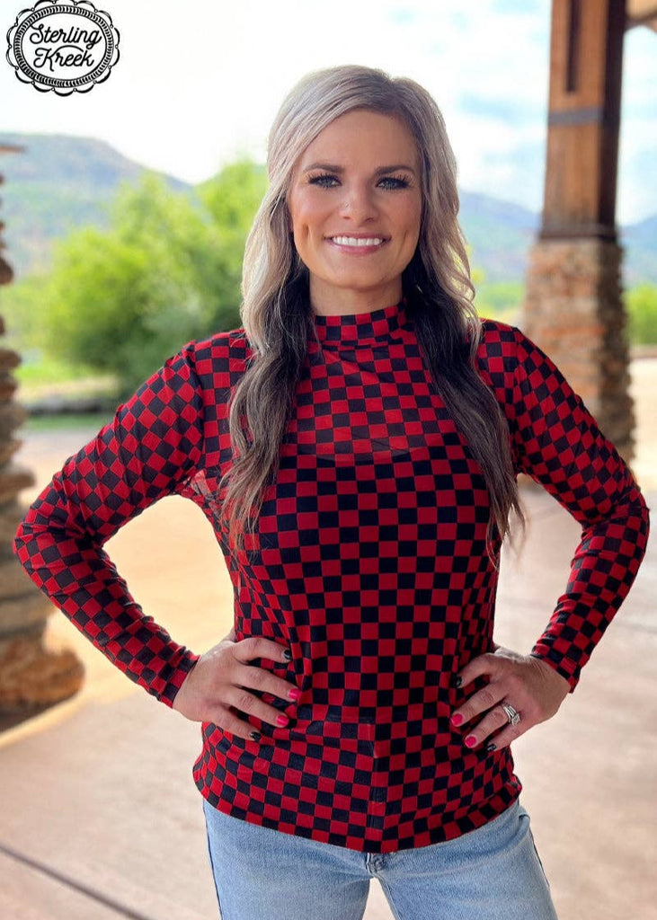 pep rally red and black mesh checkered long sleeve shirt.  This shirt runs a little larger than expected.  Suggested to pare down one size.  The model is wearing with faded jeans and a tank top under the mesh top.