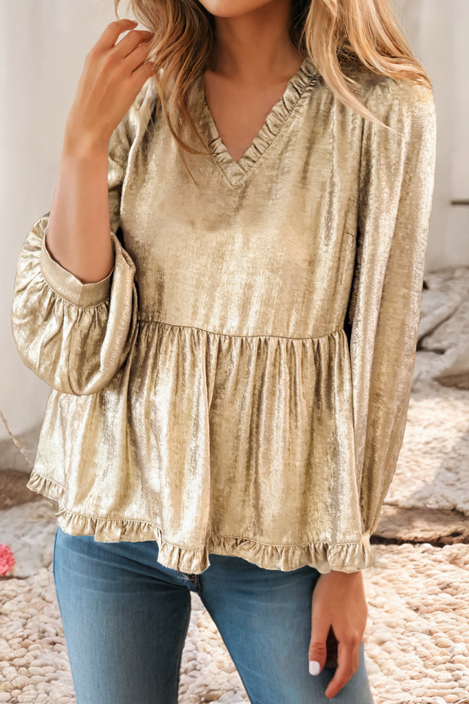 A metallic gold ruffled b-neck with 3/4 sleeves in a baby doll style