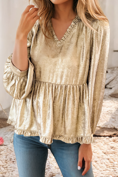 A metallic gold ruffled b-neck with 3/4 sleeves in a baby doll style