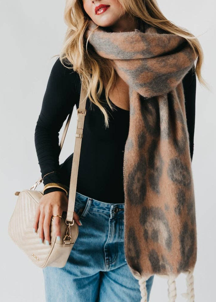 Pracillia leopard print oversized scarf with white twist tassels.