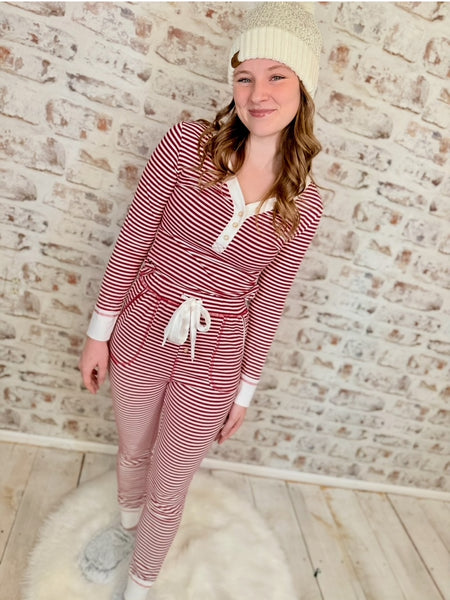 white and red stripe pajamas.  V-neck top is long sleeved, and the bottoms have a draw string and pockets