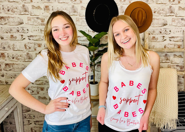 Women wearing White Laney Lu's Shirt with Pink Lettering