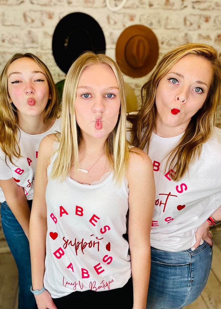 Women wearing White Laney Lu's Shirt with Pink Lettering