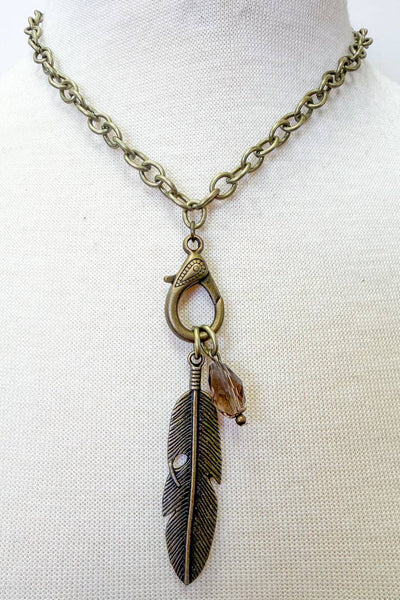 Adjustable, short bronze necklace with leaf charm.