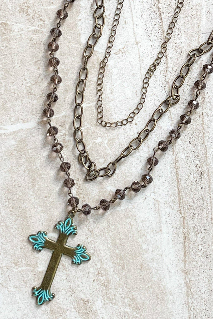 Adjustable, 3 strand necklace with 2 chain link strands and a beaded strand with cross pendant. 13" 