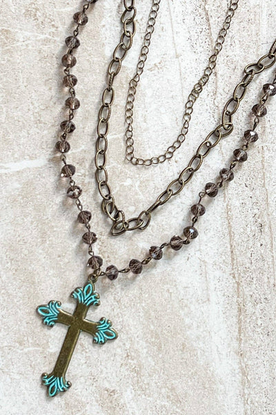 Adjustable, 3 strand necklace with 2 chain link strands and a beaded strand with cross pendant. 13" 