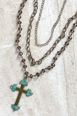 Adjustable, 3 strand necklace with 2 chain link strands and a beaded strand with cross pendant. 13" 