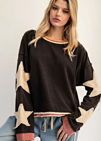 Long sleeved ash black base, with cream color star accents on sleeves