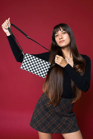  Top zipper closure with two major compartments and 1 middle zipper pocket -Interior Pockets: 2 slip pockets and 6 cardholders -Straps: Detachable wristlet strap, Adjustable/detachable shoulder strap -Hardware: Gold-tone hardware - Fabric with vegan leather Dimensions: -Length: 9 inches -Depth: 1.5 inches -Height: 5 inches . Finished with gold-tone hardware and crafted from a combination 