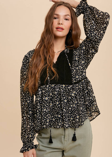 black floral tie neck blouse, long sleeved with elastic slight flair wrist
