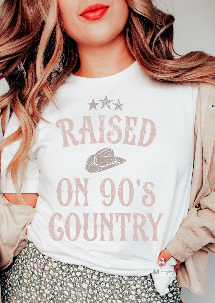Woman wearing t-shirt that says Raised On 90's Country Music 